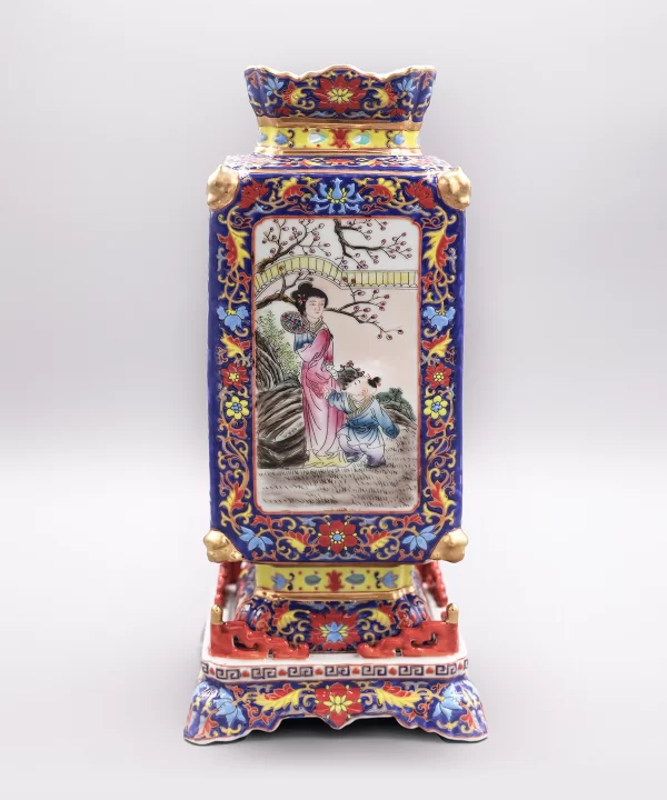 a colorful vase with a painting on it